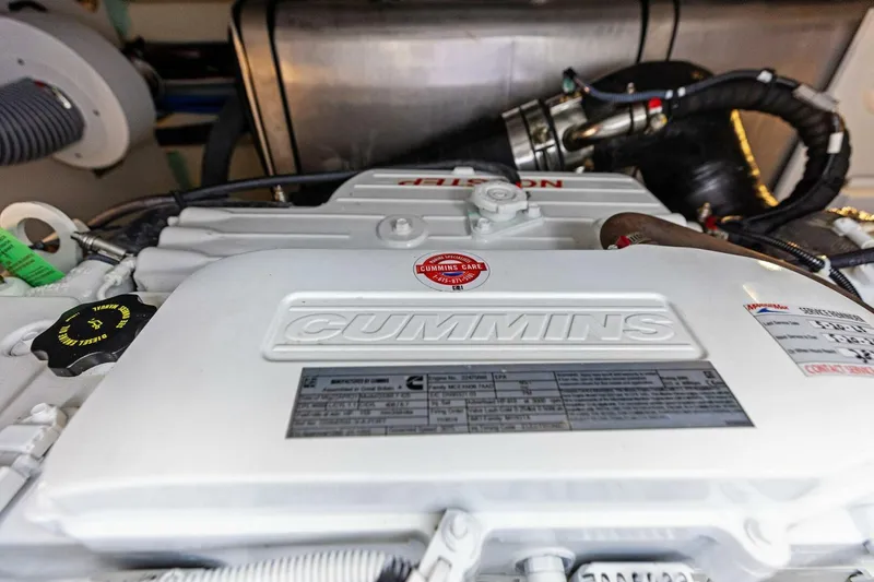 So Fly Yacht Photos Pics Cummins engine in 2022 Prestige 420 yacht, showcasing detailed components and labels.