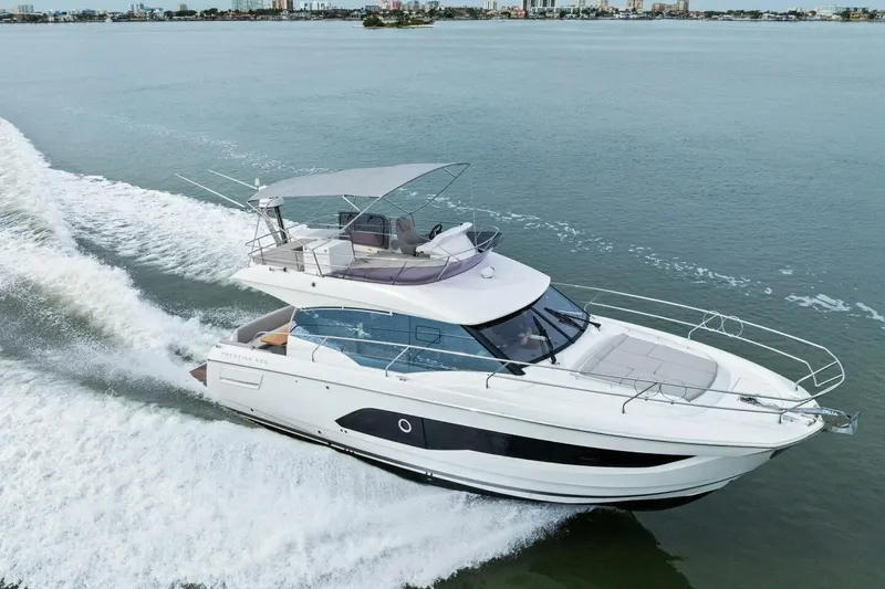 So Fly Yacht Photos Pics 2022 Prestige 420 yacht cruising on open water, showcasing sleek design and luxury features.