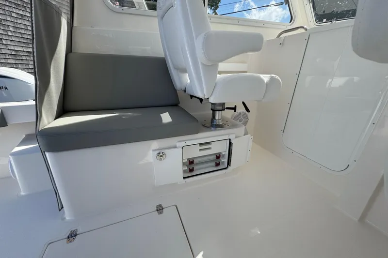  Yacht Photos Pics Interior of 2025 NorthCoast 255 HT boat with seating and storage.