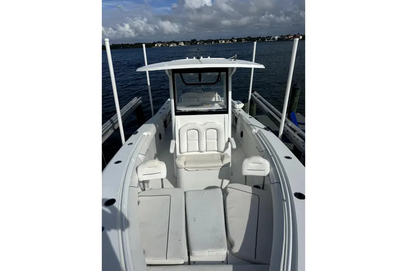  Yacht Photos Pics 2018 Sea Hunt Gamefish 30 boat with forward seating, docked on a sunny day.