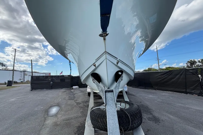  Yacht Photos Pics 2018 Sea Hunt Gamefish 30 boat on trailer, viewed from front, under blue sky.