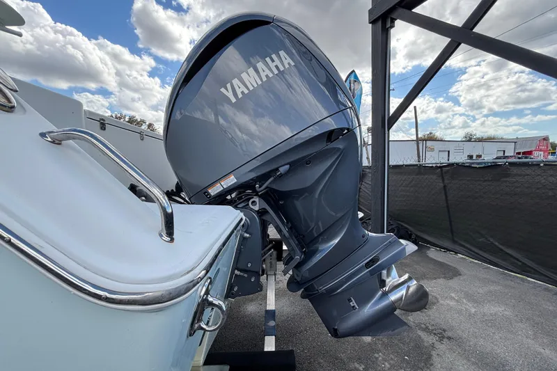  Yacht Photos Pics 2018 Sea Hunt Gamefish 30 with Yamaha outboard motor, parked under cloudy sky.