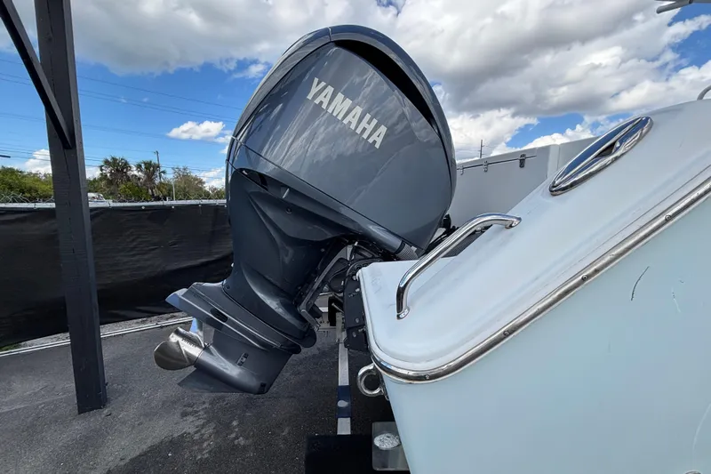  Yacht Photos Pics 2018 Sea Hunt Gamefish 30 with Yamaha outboard motor, parked under a cloudy sky.
