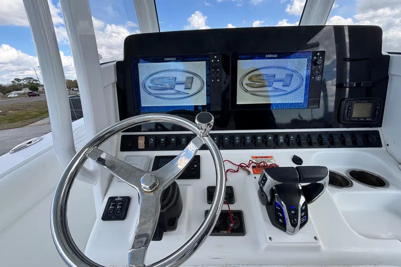  Yacht Photos Pics 2018 Sea Hunt Gamefish 30 helm with dual Simrad displays and steering wheel.