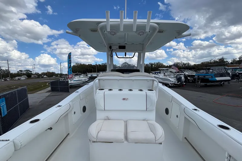  Yacht Photos Pics 2018 Sea Hunt Gamefish 30 Forward Seating boat at a dealership under a cloudy sky.