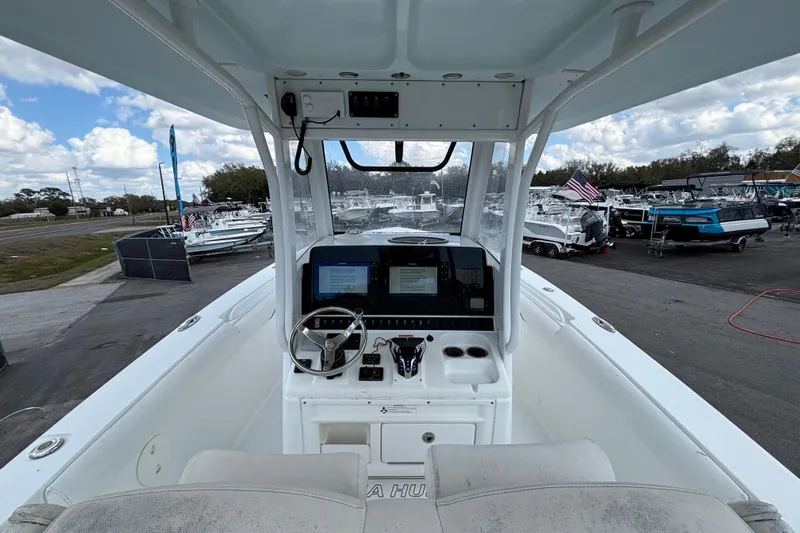  Yacht Photos Pics 2018 Sea Hunt Gamefish 30 boat interior with forward seating and control panel.
