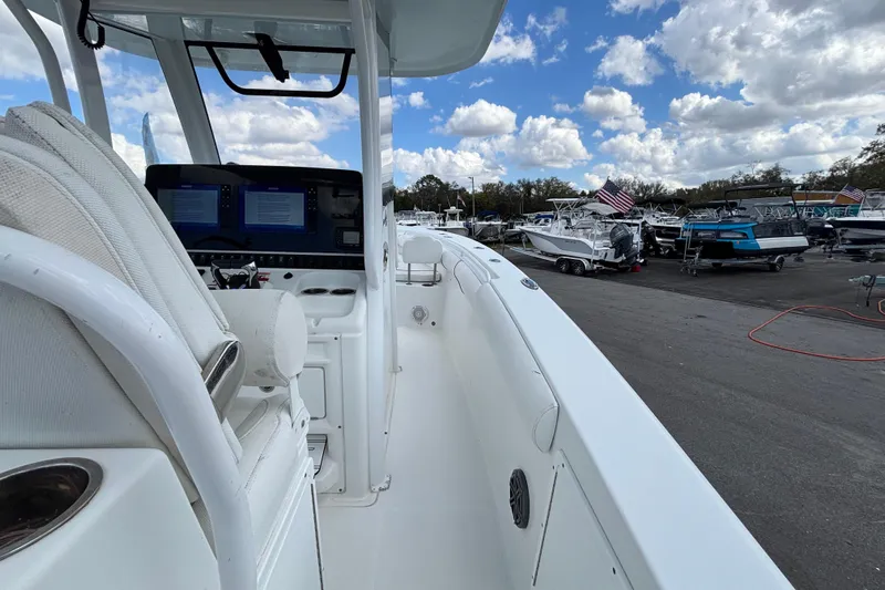  Yacht Photos Pics 2018 Sea Hunt Gamefish 30 boat interior with forward seating, docked under a cloudy sky.
