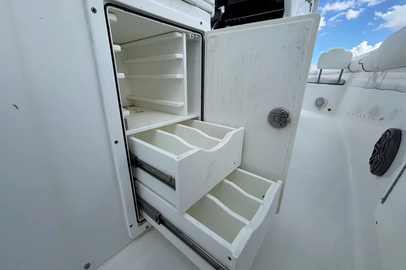  Yacht Photos Pics 2018 Sea Hunt Gamefish 30 storage compartment with open drawers and shelves.