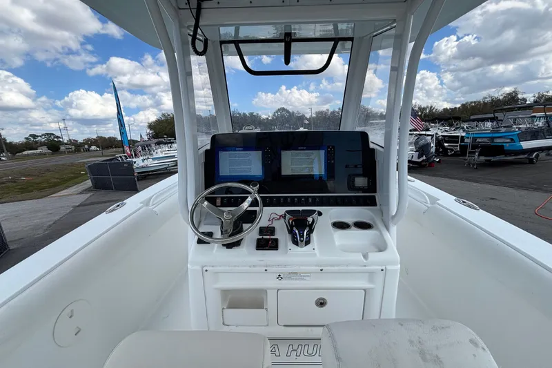  Yacht Photos Pics 2018 Sea Hunt Gamefish 30 boat cockpit with steering wheel and navigation screens.