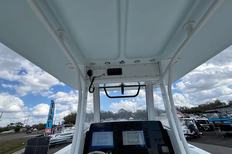  Yacht Photos Pics 2018 Sea Hunt Gamefish 30 helm view with electronics, under a cloudy sky.