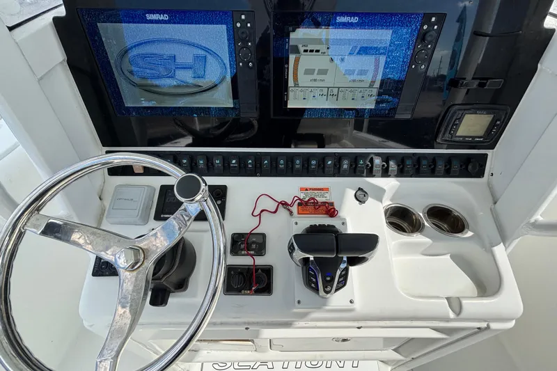  Yacht Photos Pics 2018 Sea Hunt Gamefish 30 dashboard with dual Simrad displays and steering wheel.