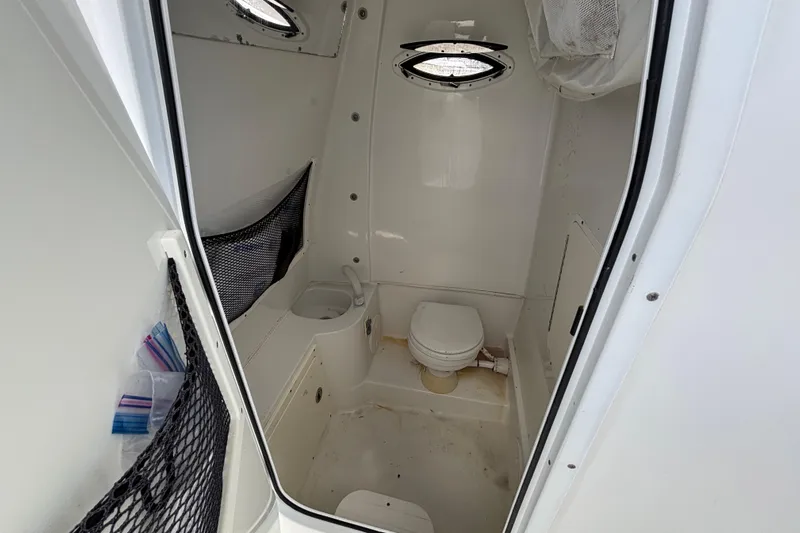  Yacht Photos Pics 2018 Sea Hunt Gamefish 30 boat interior bathroom with toilet and storage.