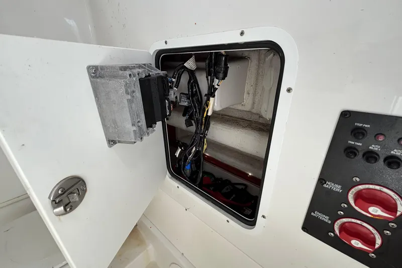  Yacht Photos Pics Open electrical panel on 2018 Sea Hunt Gamefish 30 boat, showing wiring and controls.