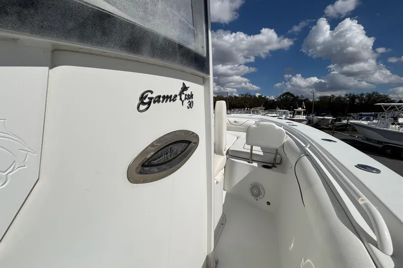  Yacht Photos Pics 2018 Sea Hunt Gamefish 30 boat with forward seating under a cloudy sky.