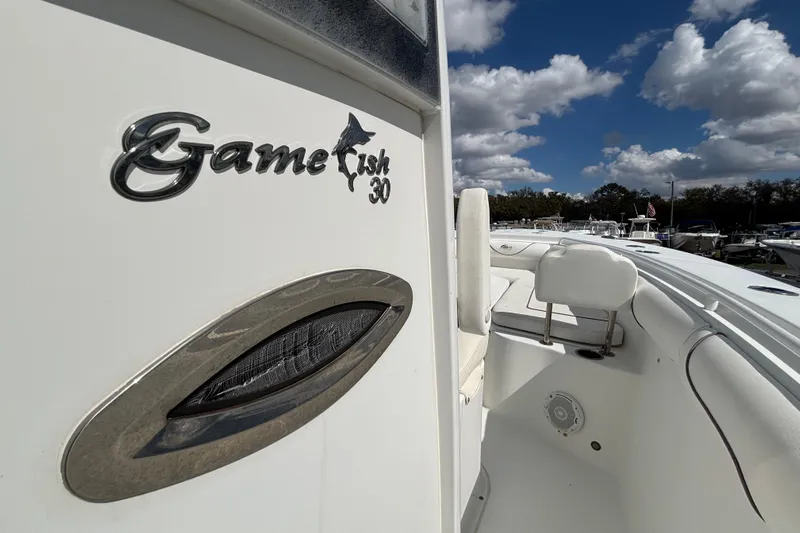  Yacht Photos Pics 2018 Sea Hunt Gamefish 30 boat with forward seating, under a partly cloudy sky.