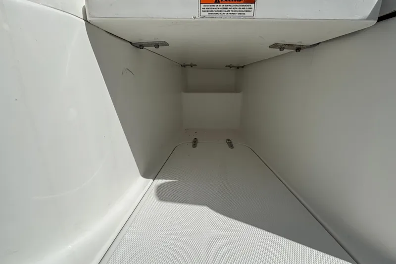  Yacht Photos Pics 2018 Sea Hunt Gamefish 30 Forward Seating storage compartment, white interior, open hatch.