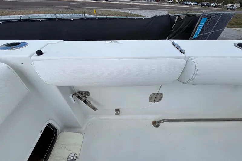  Yacht Photos Pics 2018 Sea Hunt Gamefish 30 Forward Seating boat interior, featuring white upholstery and stainless steel fittings.