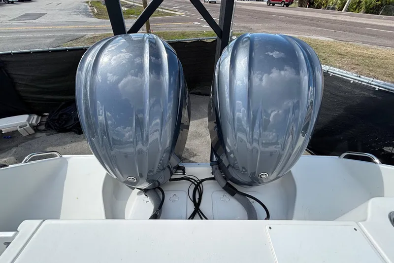  Yacht Photos Pics 2018 Sea Hunt Gamefish 30 with dual outboard motors, parked on a trailer.