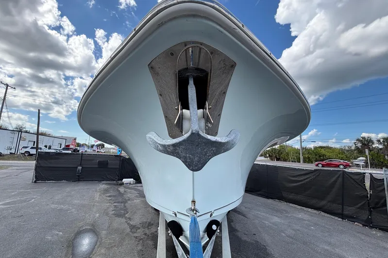  Yacht Photos Pics 2018 Sea Hunt Gamefish 30 boat on trailer, viewed from front under cloudy sky.