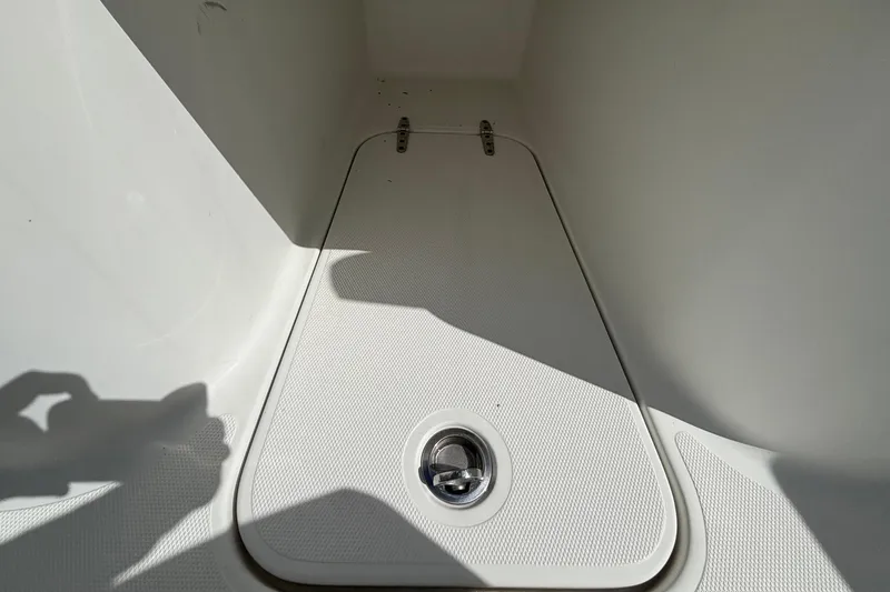  Yacht Photos Pics 2018 Sea Hunt Gamefish 30 Forward Seating storage compartment, white interior, sunlight shadow.
