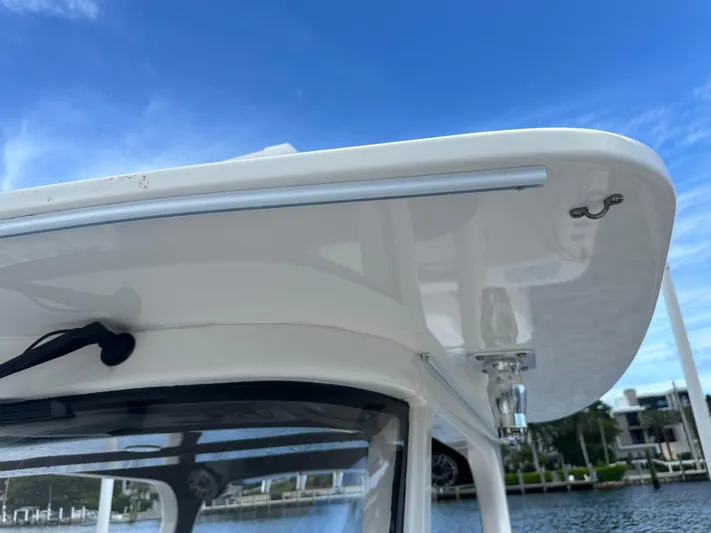 Perfection Yacht Photos Pics Edgewater 370 CC 2020 boat detail against a clear blue sky.