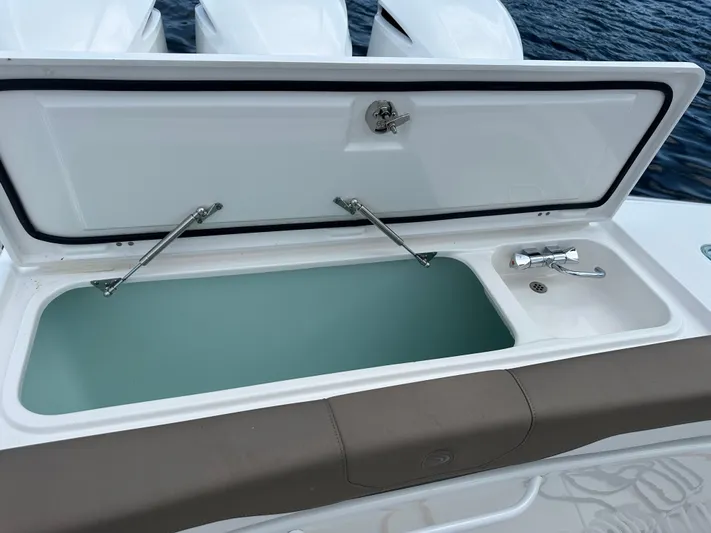 Perfection Yacht Photos Pics Edgewater 370 CC 2020 boat with open storage compartment on deck.