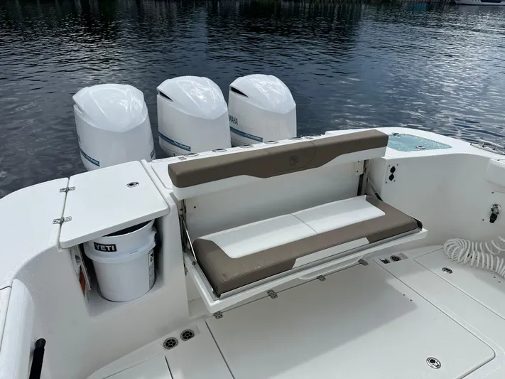Perfection Yacht Photos Pics 2020 Edgewater 370 CC boat with triple outboard engines and foldable seating.