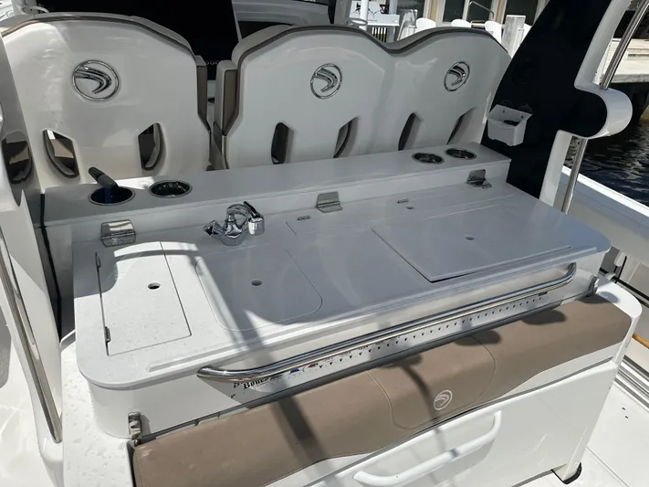 Perfection Yacht Photos Pics Edgewater 370 CC 2020 boat interior with seating and utility area.