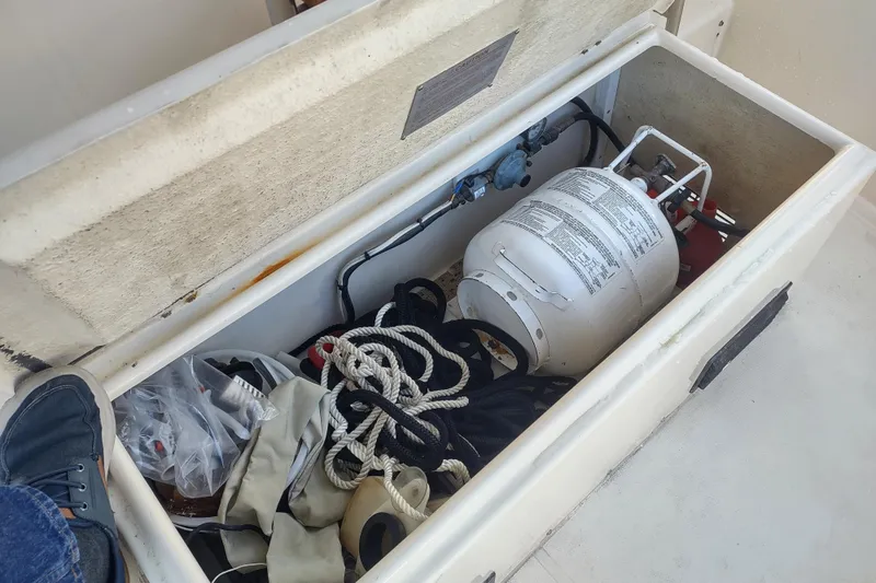 Green Goose Yacht Photos Pics Open storage compartment on 1998 Nordic Tug 42 with propane tank and ropes.