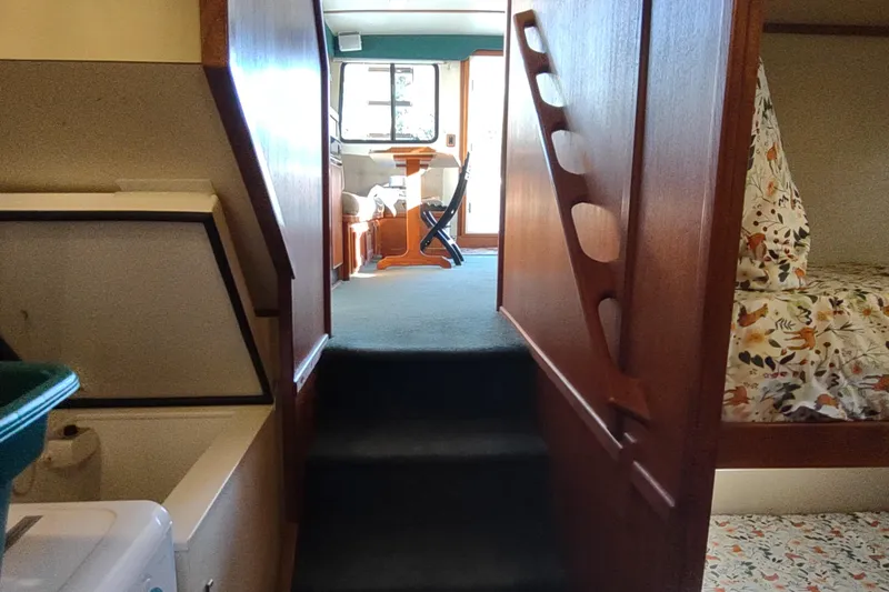 Green Goose Yacht Photos Pics Interior of a 1998 Nordic Tug 42, featuring cozy cabin and wooden accents.