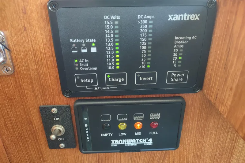 Green Goose Yacht Photos Pics Control panel of a 1998 Nordic Tug 42 with Xantrex and TankWatch 4 systems.