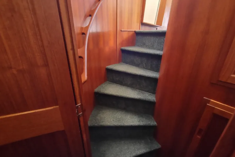 Green Goose Yacht Photos Pics Staircase with wooden paneling inside a 1998 Nordic Tug 42 boat.
