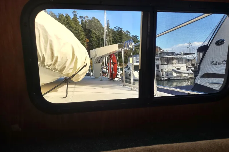 Green Goose Yacht Photos Pics View from Nordic Tug 42, 1998 model, showing marina and boats through window.