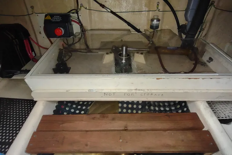 Green Goose Yacht Photos Pics Engine compartment of a 1998 Nordic Tug 42 with visible control panel.