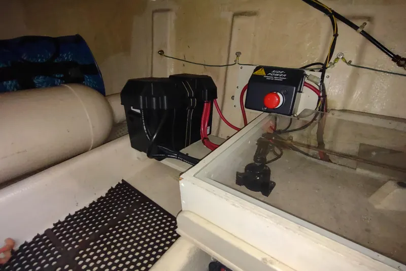 Green Goose Yacht Photos Pics Engine compartment of a 1998 Nordic Tug 42, featuring battery and control panel.