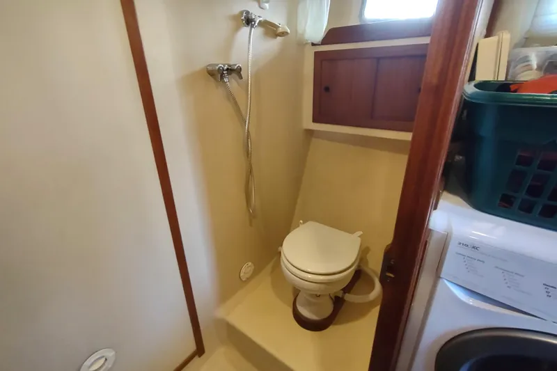 Green Goose Yacht Photos Pics Bathroom in 1998 Nordic Tug 42 with shower, toilet, and washing machine.