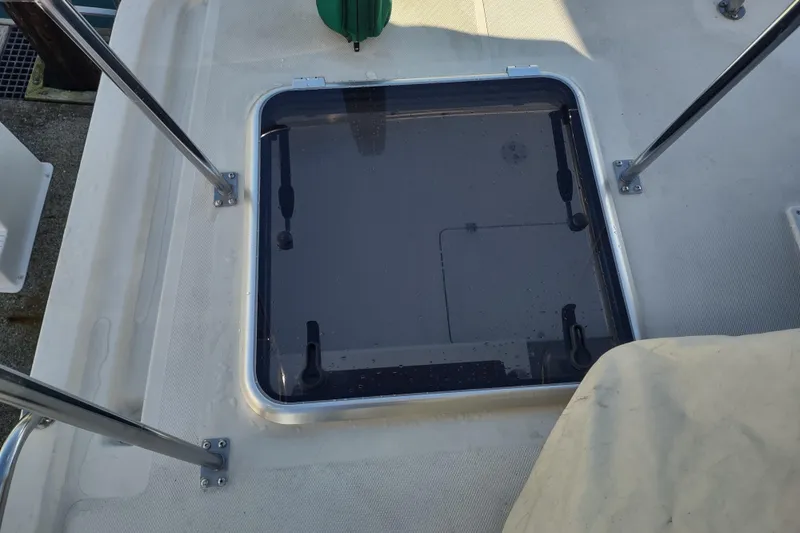 Green Goose Yacht Photos Pics Hatch on 1998 Nordic Tug 42 boat deck, featuring stainless steel railing.