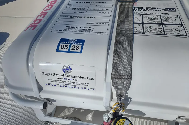 Green Goose Yacht Photos Pics Inflatable liferaft on 1998 Nordic Tug 42, featuring inspection details and Puget Sound Inflatables label.