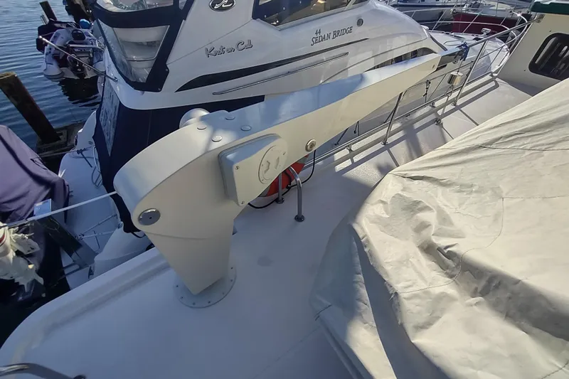 Green Goose Yacht Photos Pics 1998 Nordic Tug 42 yacht deck with davit system and covered equipment.