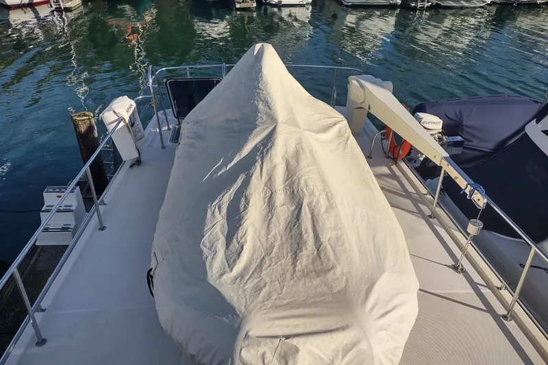 Green Goose Yacht Photos Pics Covered deck of a 1998 Nordic Tug 42 at a marina.