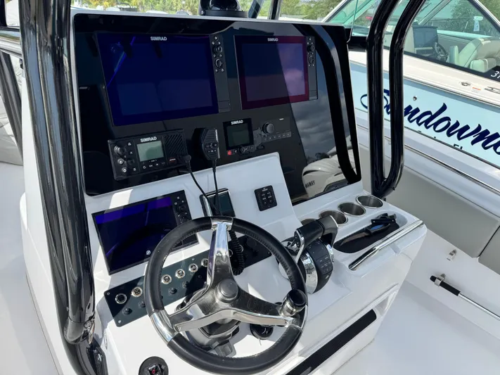  Yacht Photos Pics 2022 Cape Horn 32 T boat dashboard with steering wheel and electronic displays.