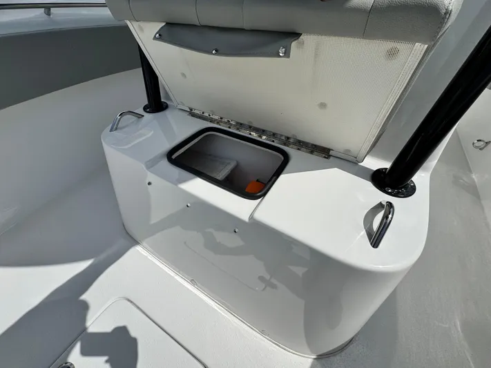  Yacht Photos Pics 2022 Cape Horn 32 T boat storage compartment with open seat and visible interior.