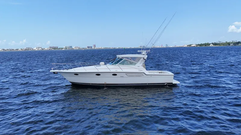 Extremely Clean Boat Yacht Photos Pics 2000 Tiara Yachts 3700 Open cruising on a sunny day in open waters.