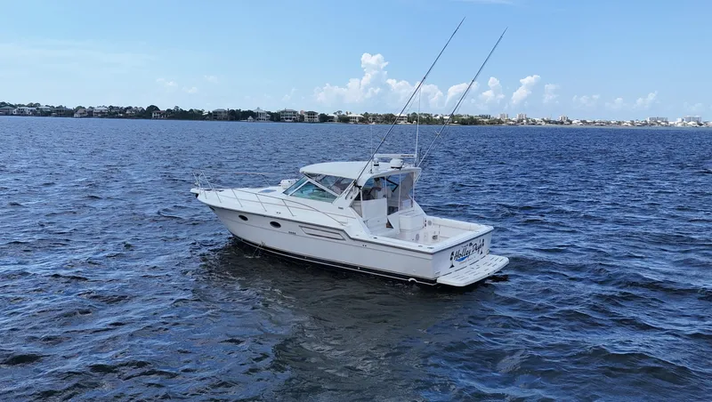 Extremely Clean Boat Yacht Photos Pics 2000 Tiara Yachts 3700 Open cruising on a calm blue sea under a clear sky.