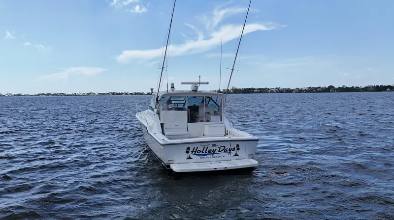 Extremely Clean Boat Yacht Photos Pics 2000 Tiara Yachts 3700 Open on water, rear view, clear sky.