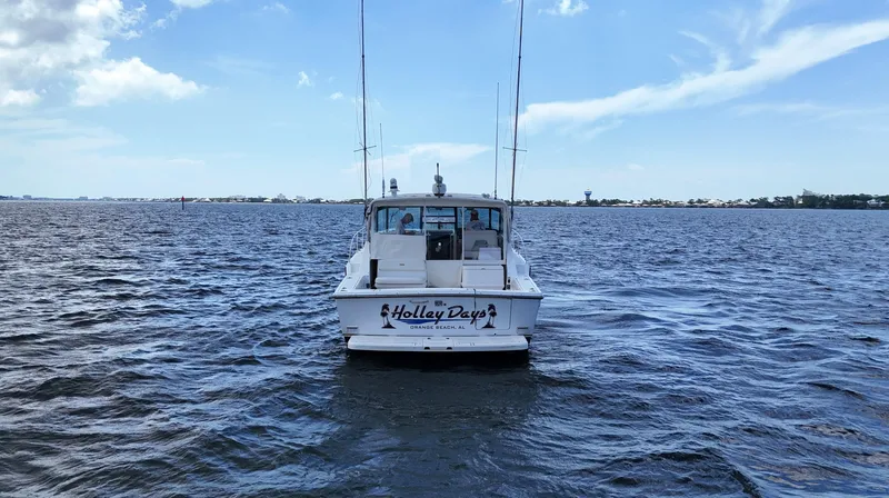 Extremely Clean Boat Yacht Photos Pics 2000 Tiara Yachts 3700 Open on calm water under a clear blue sky.