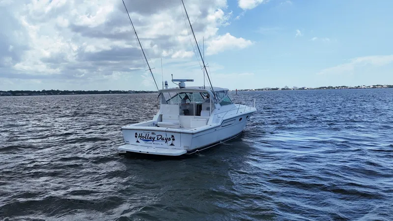 Extremely Clean Boat Yacht Photos Pics 2000 Tiara Yachts 3700 Open boat on open water under a partly cloudy sky.