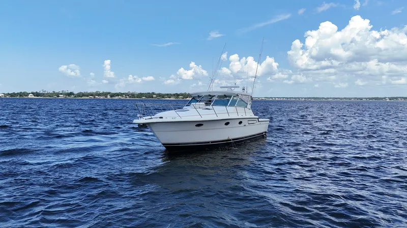 Extremely Clean Boat Yacht Photos Pics 2000 Tiara Yachts 3700 Open cruising on a sunny day with blue skies.