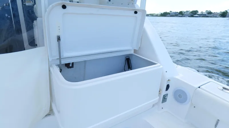 Extremely Clean Boat Yacht Photos Pics Open storage compartment on 2000 Tiara Yachts 3700 Open, with water view.