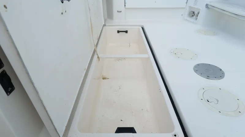 Extremely Clean Boat Yacht Photos Pics Open storage compartment on a 2000 Tiara Yachts 3700 Open boat deck.